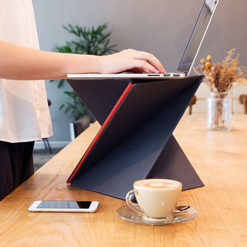 Foldable portable laptop stand on desk
