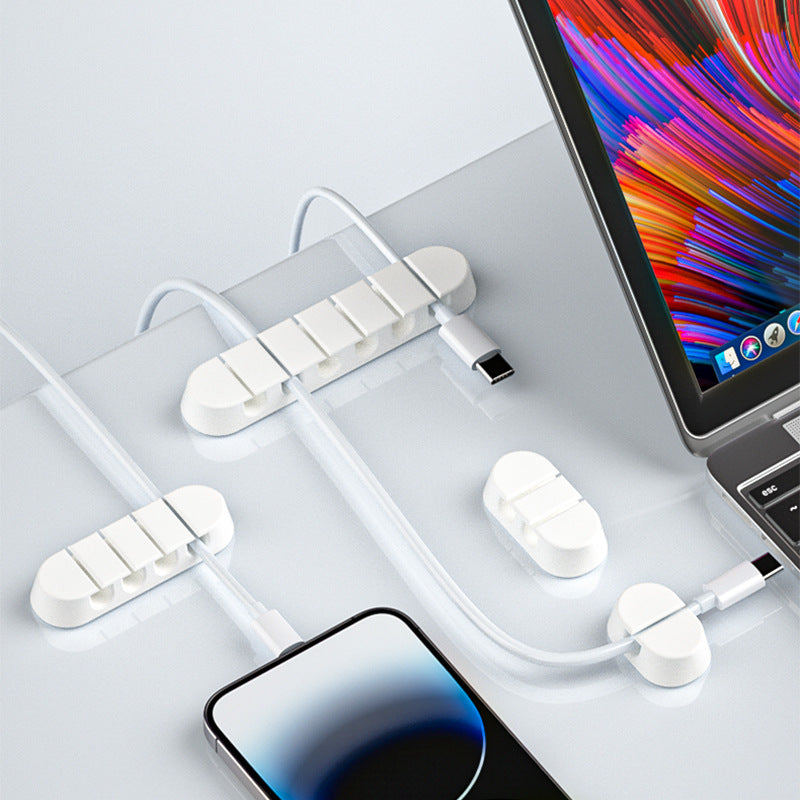 Silicone self adhesive desk cable organizer holding charging cables